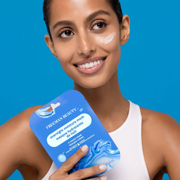 Person holding a Freeman Moisture Mask Face Set with cream applied to their cheek