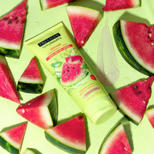 Freeman Watermelon and Aloe Cooling Gel Facial Mask tube surrounded by fresh watermelon slices