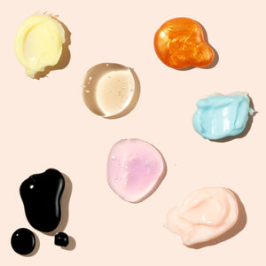 Assorted facial mask textures in six colors: black, cream, pink, blue, and orange gel
