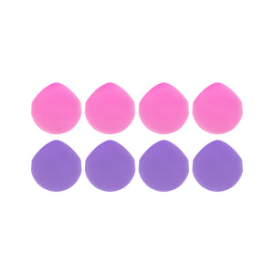 Eight round liquid makeup puffs in pink and purple, flat strap bands