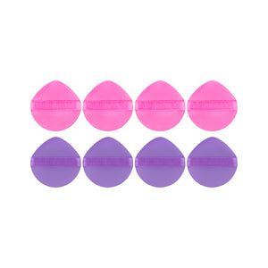 Eight round liquid makeup puffs: four hot pink and four purple with flat strap tops