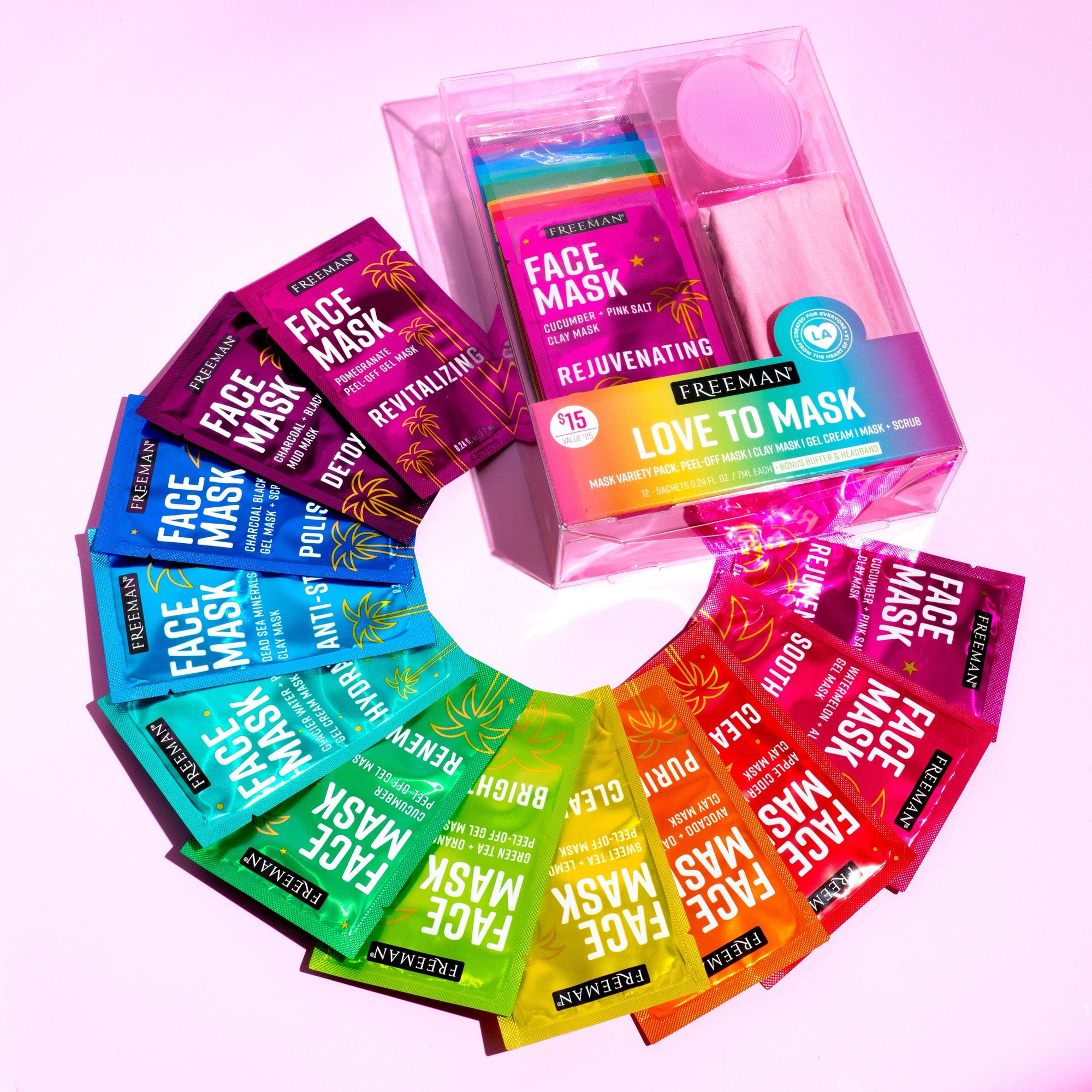 Assorted Freeman face mask packets around a clear tray featuring a round pink applicator pad