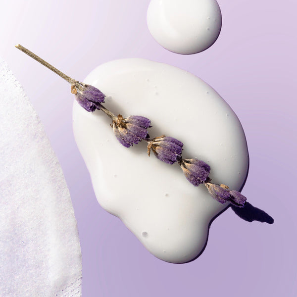 White sheet mask fabric over a mannequin head with lavender buds
