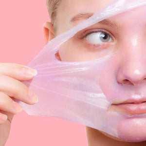 Peel-off gel mask applied on face, forming a thin translucent layer