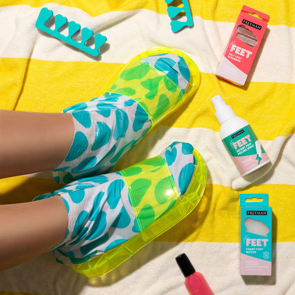 Foot mask booties on feet with teal-and-green pattern, plus foot mask packaging