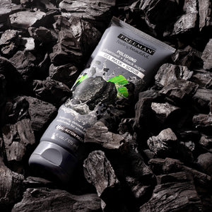 Freeman exfoliating gel mask tube on black charcoal pieces