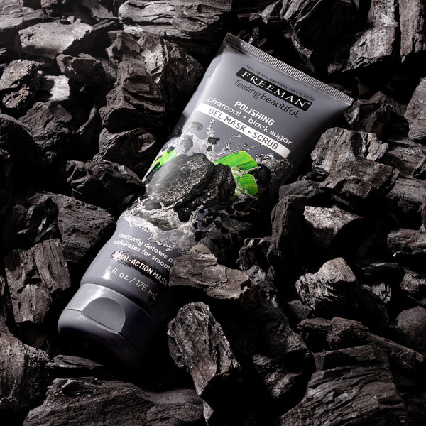 Freeman exfoliating gel mask tube on black charcoal pieces
