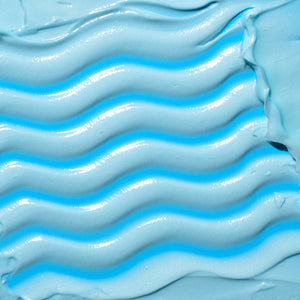 Thick light-blue gel cream mask texture, glossy swirl