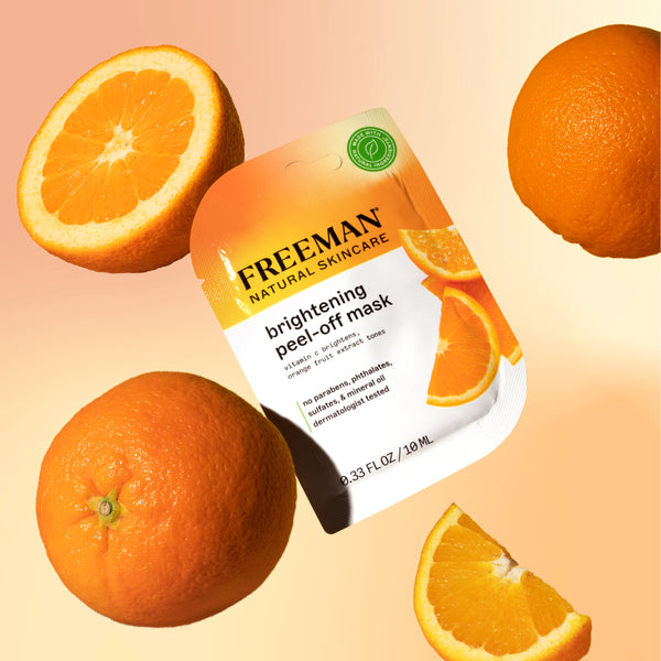 Freeman brightening peel-off mask pouch with orange fruits around it